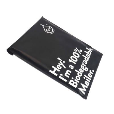 China 100% Biodegradable Custom Printed Black Biodegradable Shipping Poly Mailer Bags Polymailer With Die Cut Handle for sale