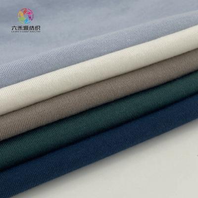 China Non-defrmation JYY Nonwoven Garment Interlock Knit 100% Cotton African Textile Fabrics for Clothing for sale