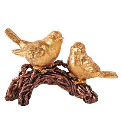 China Africa Newcomer Resin Lucky Birds Sculpture Statue With Bronze Electroplated Finished For Home Decoration for sale