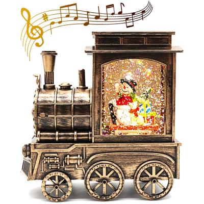 China Africa Battery Operated Water Glowing LED Snowman in Train Christmas Snow Globe Musical Lantern for sale