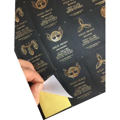 China Waterproof privately designed custom shiny gold foil printed brand logo die cut stickers sheets for sale