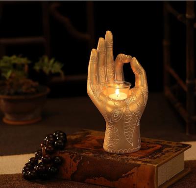 China Retro Zen Buddha Hand Mudra Handcrafted Resin Candle Holder Handmade Meditation Tea Light Holders for sale