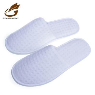 China Customized Logo White Waffle Hotel Soft Disposable Slippers for sale