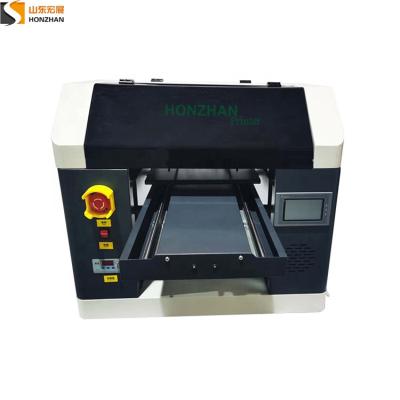 China Garment shops HZ-A324 UV printer use high quality UV inks scratch resistance and waterproof for sale