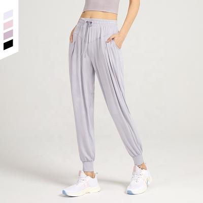 China 2021 autumn women's clothing joggers QUICK DRY sports tracksuit loose breathable pants and solid pleated women's pants for sale