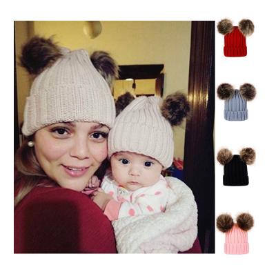 China JOINT Baby Pom Pom Hat Winter Pom Pom Hat Double Breasted Mum Baby Hat for sale