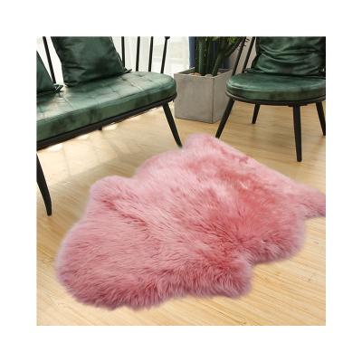 China Stain Resistant Wholesale Interlocking Sheepskin Mats Pink Sheepskin Rug for sale