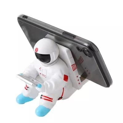 China Cell Phone Waterproof Stand Resin Holder Spaceman Mobile Phone Astronaut Resin Craft Lazy Gift for sale