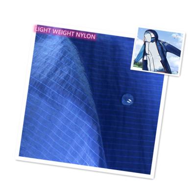 China Stretch 40d 0.6cm Nylon Plaid Ripstop Fabric For Skin Coat And Sportswear for sale