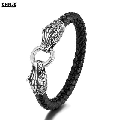 China New Popular Design Skull Bracelet Stainless Steel Double Head Bracelet Woven Leather Jewelry for sale