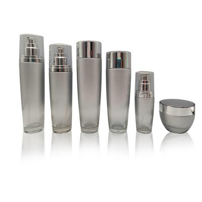 China Personal Care Pump Lotion Bottles Glass Cap Bottle Empty Silver Round Cream Glass Cosmetic for sale