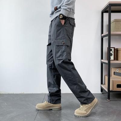 China Anti-wrinkle men's work khaki pants relaxed fit cotton leg jeans casual cargo pants 5XL elastic waist straight pants for sale