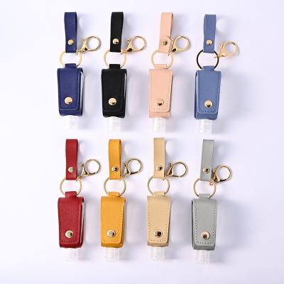 China 30ML Key Chain Hand Sanitizer Holder Travel Portable Empty Leakproof Plastic Bottle With Tassels Leather PU Key Chain Holder Carriers for sale