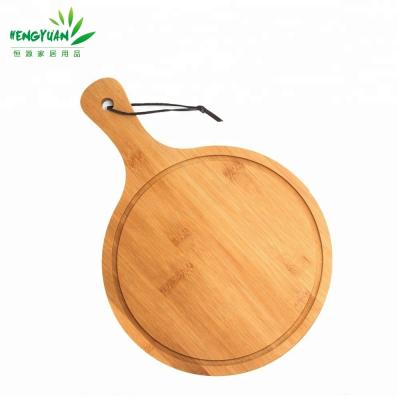 China Sustainable Eco Friendly Cooking Tools Round Pizza Cutting Board With Groove for sale