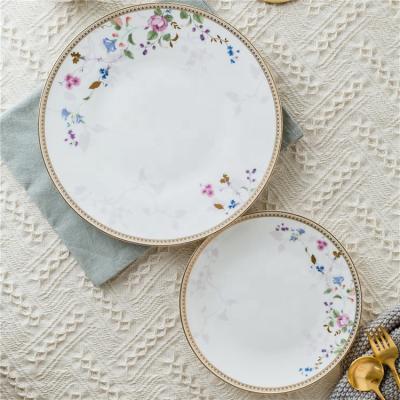 China Viable European Exotic Royal White Charger Dishes Ceramic Banquet Serving Dish Gold Rim Ceramic Dinner Dish for sale