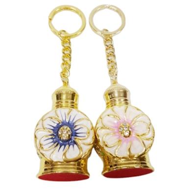 China Gold Luxury Kirsite Flower 3ml High Grade Perfume Bottle Frosted Essential Oil Glass Bottle Dropper Head Chain Glass Bottle for sale