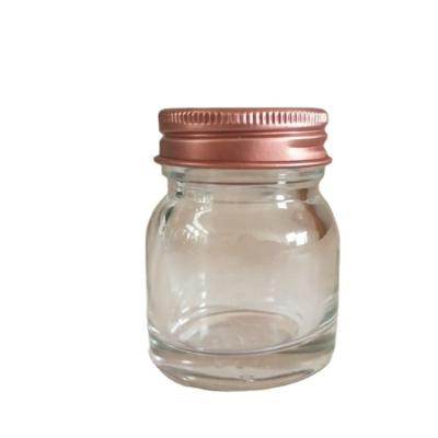 China Eco - Friendly Transparent Round Honey Jar Nest 35ml Glass Bottle With Screw Cap for sale