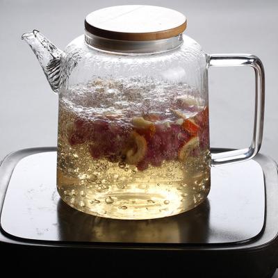 China Viable Chinese Flower Teapot Supplier Pyrex Transparent Spring Strainer Special Blooming Teapots With Bamboo Cover for sale