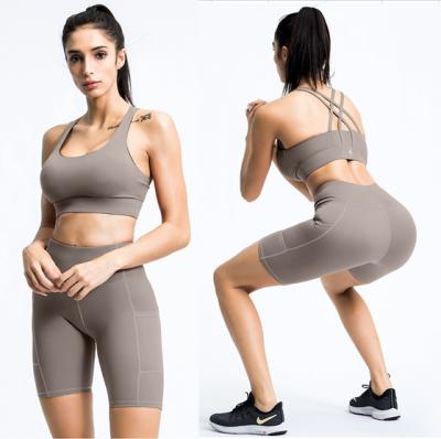 China Lady High Quality Breathable Workout Leggings Gym Set Crop Strappy High Waist Top Pocket Shorts Women Fitness Yoga Wear for sale