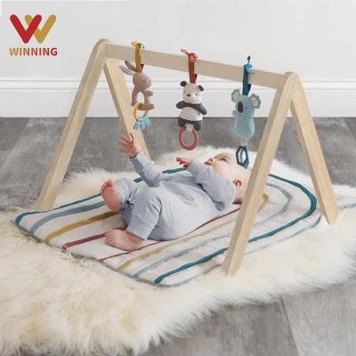 China Toy Winning Foldable Baby Play Educational Gym Frame Activity Gym with 3 Wooden Baby Teether Toys Montessori Baby Activity Gym Nursery Decor for sale