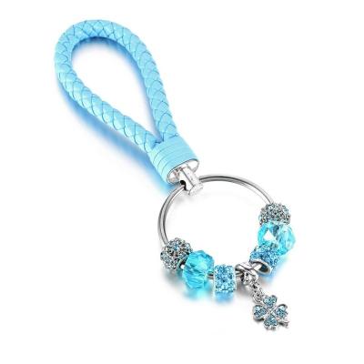 China Hot Selling European Car Ring Keychain Lucky Flower Crystal Women's Car Beads Diy PU Key Chain for sale