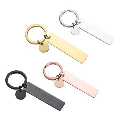 China Custom white metal key chain logo pendant diy small metal stainless steel band disc key chain tag accessories laser engraving key chain for sale