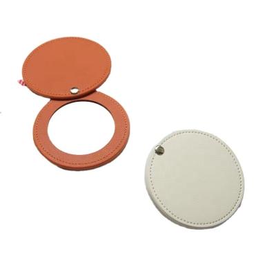 China 2023 China New Arrival Mini Vanity Mirror Pocket Mirror Wholesale Round Leather Hand Mirror for sale