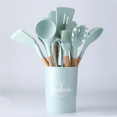 China Casual Hot Sale Cookware Accessories Sets 12Pieces Silicone Kitchen Utensils With Wooden Handle for sale