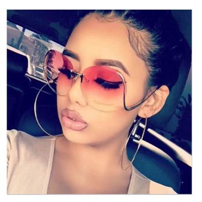 China Fashion Sunglasses 2022 Fashionable Colorful Oversized Sunglasses 2022 Brand Designer New Fashion Rimless Bend Leg Women Sun Glass Shades for sale