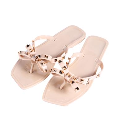 China Fashion Trend New Arrival Rhinestone Sandals For Ladies With Rivet Bow Slippers Designer Women Freeze Flip Flops for sale