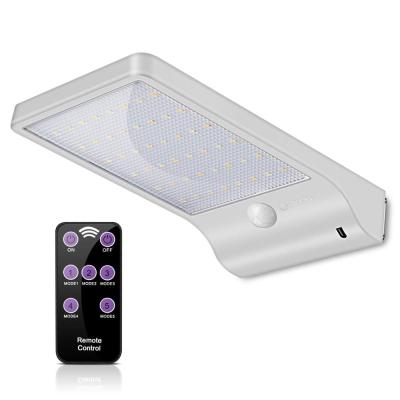 China Polycarbonate Outdoor Garden PIR Security 48 LED Remote Control Solar Wall Light Home Yard for sale