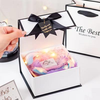 China Folding Recyclable Wholesale Exquisite Bird Magnetic Seal Gift Box Skin Care Bowknot Nest Gift Box for sale