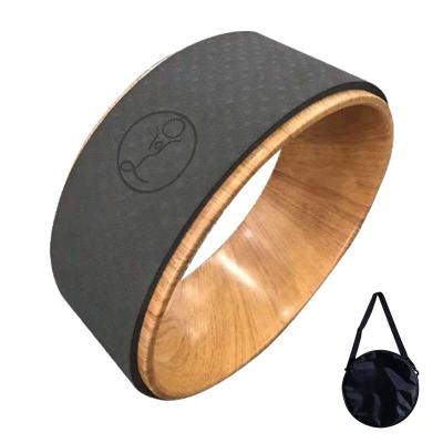 China Customized Eco-Friendly Sustainable Non-Toxic Wooden Exercise Pilates Cork Dharma Yoga Wheel Colored for sale