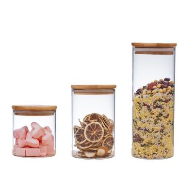 China Viable Size 6oz 8oz 11oz Wholesale Custom Glass Food Container Candy Bottle With Bamboo Lids for sale