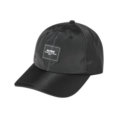 China Black Custom Stain Caps Woven Logo Hat Wholesale Unisex Sports Baseball Cap en venta