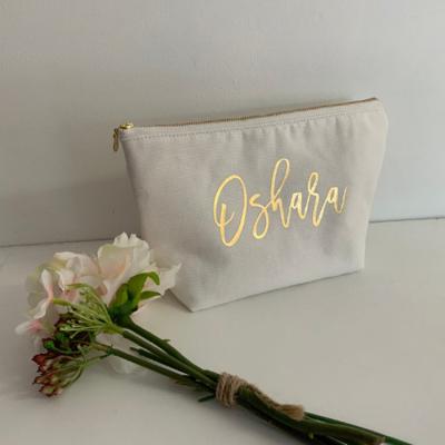 China Custom Printed Eco-friendly Gold Stamping Canvas Bag Cotton Canvas Storage Cosmetic Bag With Metal Zipper for sale