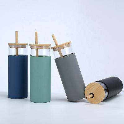 China Viable Glass Tumbler With Straw Glass Coffee Cup With Bamboo Lid Glass Water Bottle With Silicone Sleeve for sale