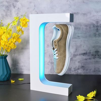 China Light Creative Top End Men's Magnetic Levitation Casual Floating Shoe Led Lighting Hoe Display Rack Shoes Show Rack for sale