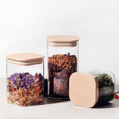 China Sustainable Factory direct selling high borosilicate glass storage tank kitchen storage bottle with bamboo cover for sale