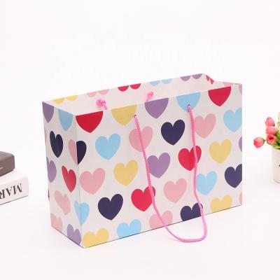 China Recyclable Durable Using Customized Gift Paper Bags Cheap Shopping Bag With Handle for sale