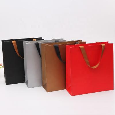 China Recyclable custom logo gift package printed bolsas reutilizables por al mayor paper bags boutique shopping bag with handles for sale