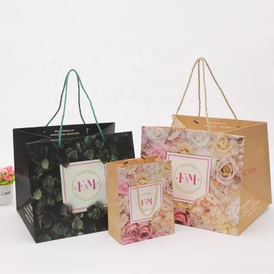 China Cheap Price Recyclable Fancy Good Quality Ivory Board Shopping Paper Bag With Custom Slogan And Logo Printing for sale