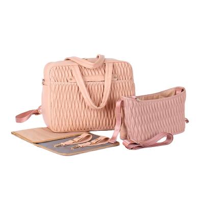 China 2021 New Design Anti-theft Portable Leather Pink Small Maternity Custom Printed Diaper Baby Bags For Mothers With Bed for sale