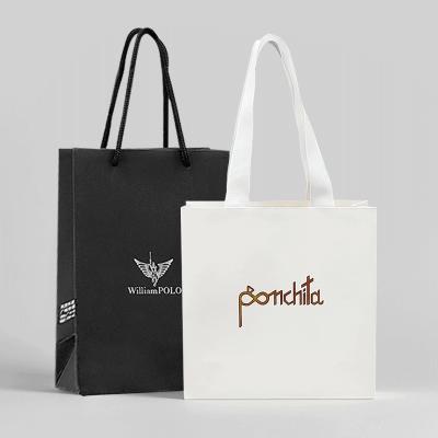 China Luxury Clothing Paper Shopping Bags White Gift Bags With Ribbon Handles for sale