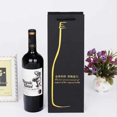 China Matte Black Kraft Paper Red Wine Gift Bags With Flexi Loop Handle for sale