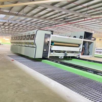 China 1000 kg Gewicht 4 Kleurenprinter Slotter Flexo Printing Slotting Die Cutting Machine Te koop