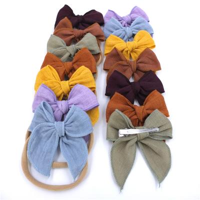 China Soft Custom Canvas Bow Hair Clips Toddler Babies Kids Nylon Hair Bow Fable Waist Headbands for sale