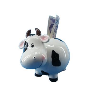 China Animal shape cartoon ceramic piggy bank cute design cow lovely piggy bank, euro cow money bank for sale