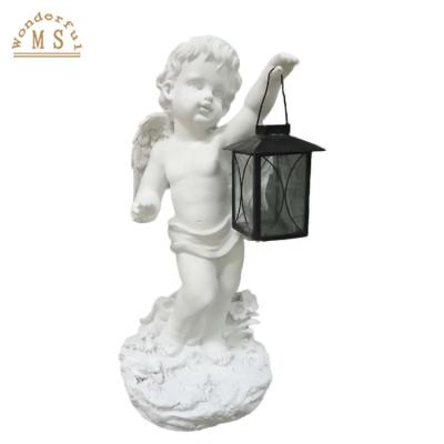 China Minimalist White Resin Angel Holding Lantern for Garden Decoration, Beautiful Concrete Angel Candle Holder, Standing Cupid Angel Statue Decor for sale