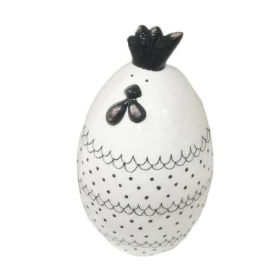 China Europe black line painting ceramic chicken egg ornament with wreath design for easter decoration for sale